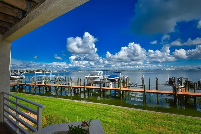 a view of a lake with a house in the background