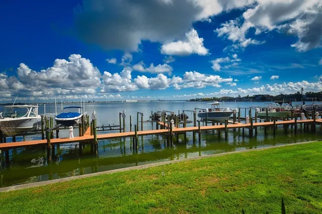 a bathroom with a swimming pool table and chairs