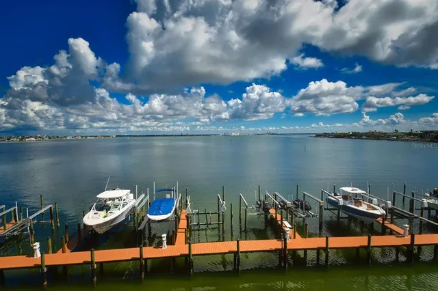 a bathroom with a sink mirror and vanity
