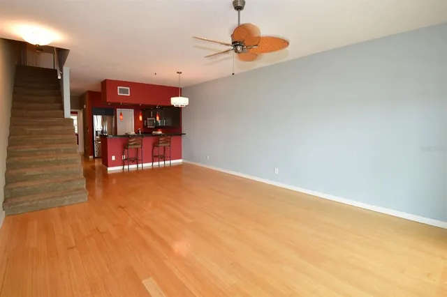 a kitchen with stainless steel appliances granite countertop a refrigerator and a microwave