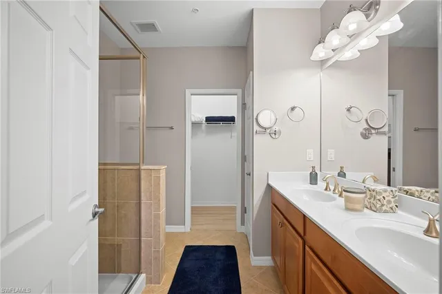 a bathroom with a sink vanity and a mirror