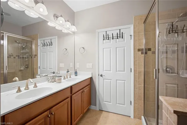 a bathroom with a double vanity sink mirror and double