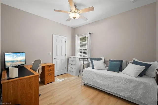 a bedroom with furniture and a window