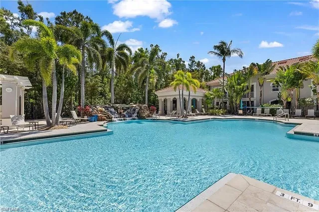 a view of swimming pool and outdoor seating