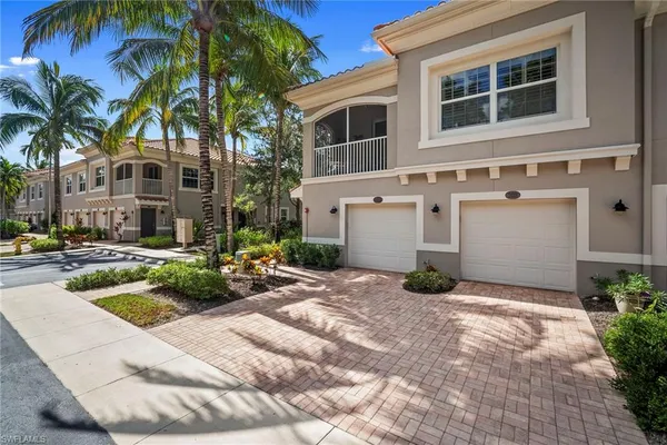 a view of a house with backyard and swimming pool