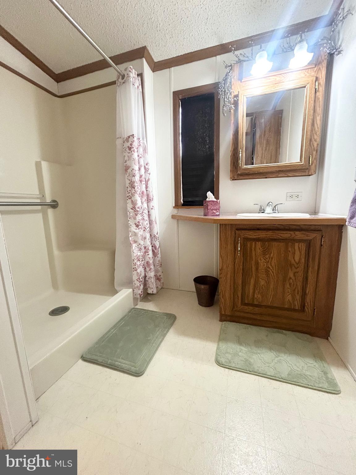 1079 Sage Avenue Reading, PA 19605 - Photo 10 of 12 a bathroom with a tub sink and mirror
