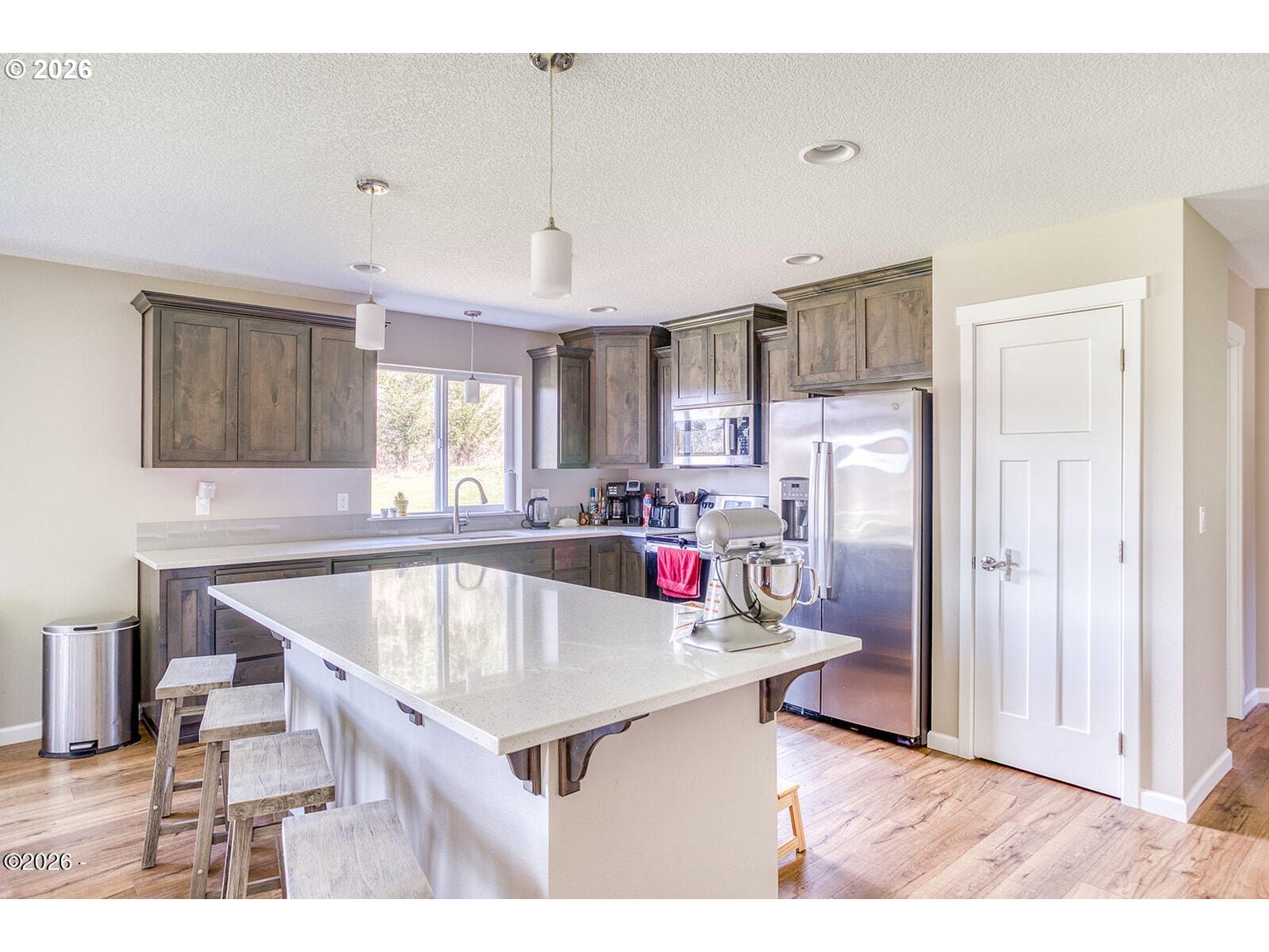 33803 Highway 22 Hebo, OR 97122 - Photo 13 of 40 a view of kitchen with refrigerator microwave and wooden floor