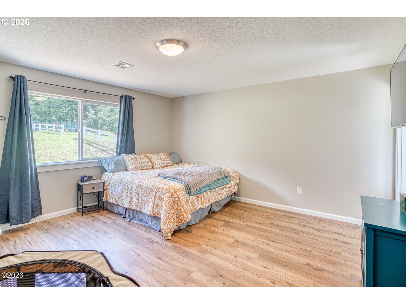 33803 Highway 22 Hebo, OR 97122 - Photo 19 of 40 a bedroom with a bed and a night stand