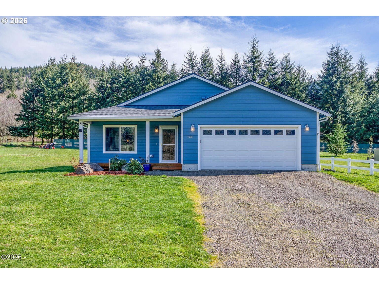 33803 Highway 22 Hebo, OR 97122 - Photo 2 of 40 a front view of a house with yard and green space
