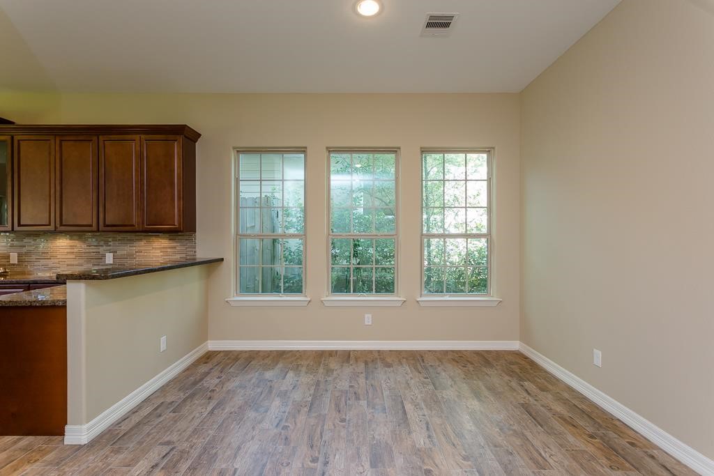 8403 Oak Knot Drive Spring, TX 77389 - Photo 16 of 31 a view of a kitchen with wooden floor and electronic appliances