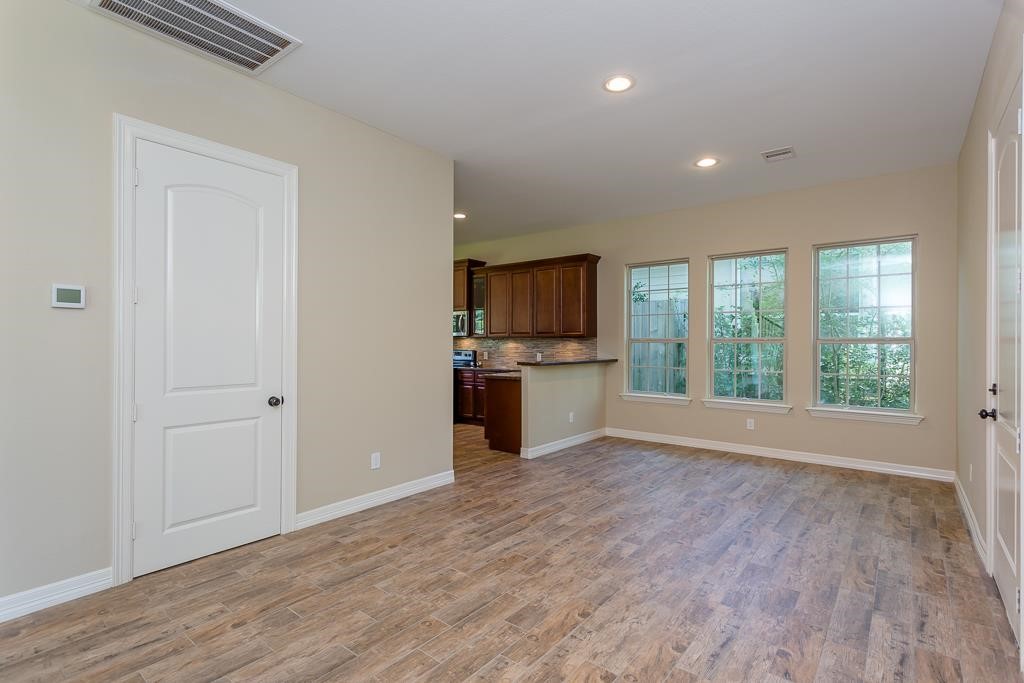 8403 Oak Knot Drive Spring, TX 77389 - Photo 17 of 31 a view of a kitchen with a sink and dishwasher kitchen view with wooden floor
