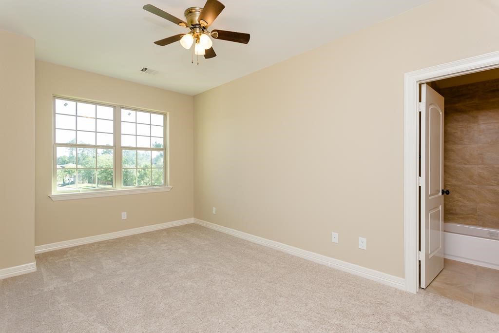 8403 Oak Knot Drive Spring, TX 77389 - Photo 25 of 31 an empty room with windows and fan