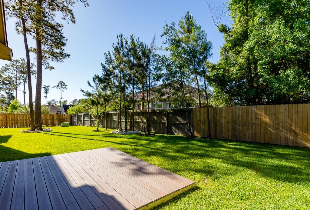 8403 Oak Knot Drive Spring, TX 77389 - Photo 30 of 31 a view of a backyard with wooden floor