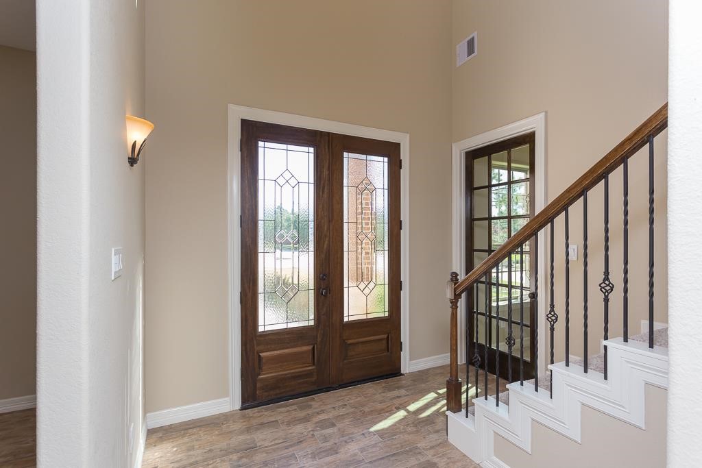 8403 Oak Knot Drive Spring, TX 77389 - Photo 3 of 31 a view of an entryway with staircase