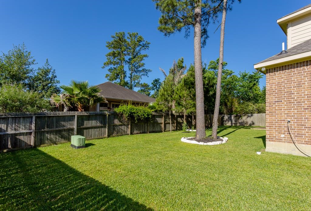 8403 Oak Knot Drive Spring, TX 77389 - Photo 31 of 31 a view of a backyard with a slide