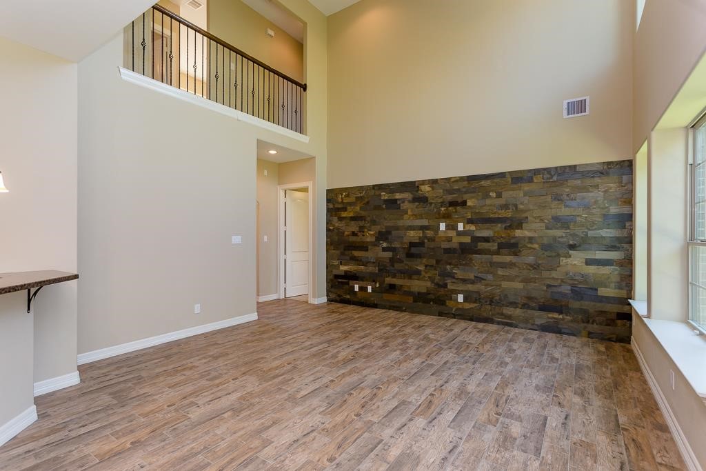 8403 Oak Knot Drive Spring, TX 77389 - Photo 7 of 31 a view of an empty room with wooden floor