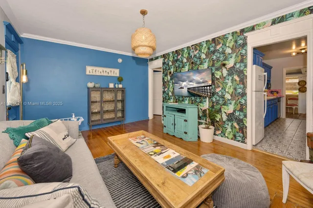 a living room with a couch and a bookshelf