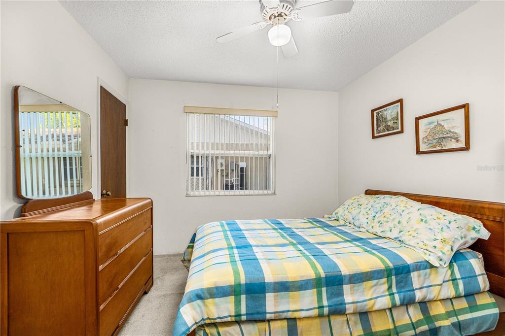 693 Reillys Road Port Orange, FL 32127 - Photo 24 of 31 a bedroom with a bed and a window