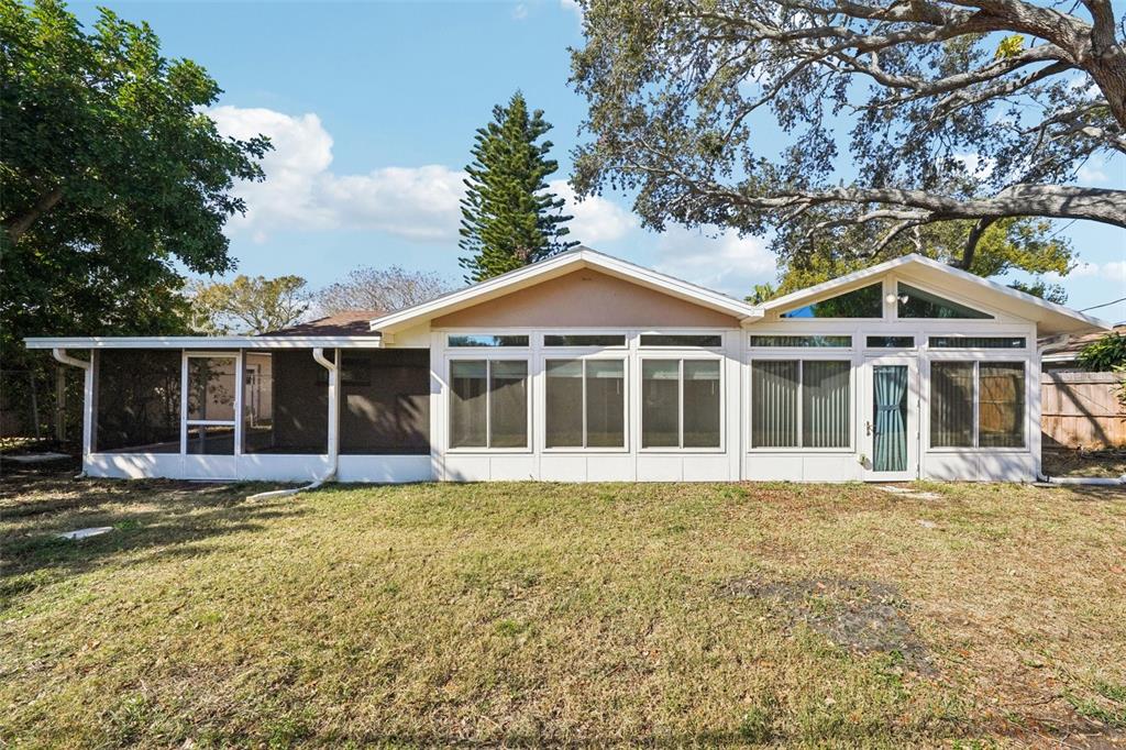 1975 Temple Terrace Clearwater, FL 33764 - Photo 51 of 69 a front view of a house with a yard