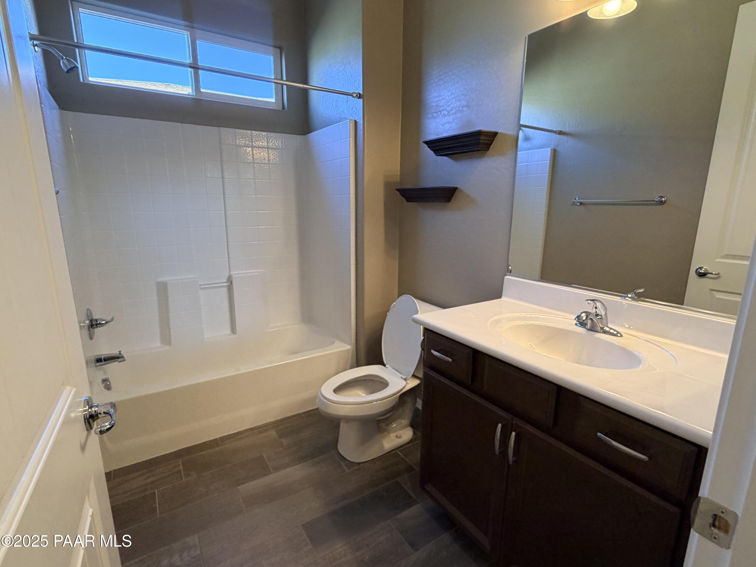 12937 East Sandoval Street Dewey, AZ 86327 - Photo 15 of 27 a bathroom with a sink a toilet and shower