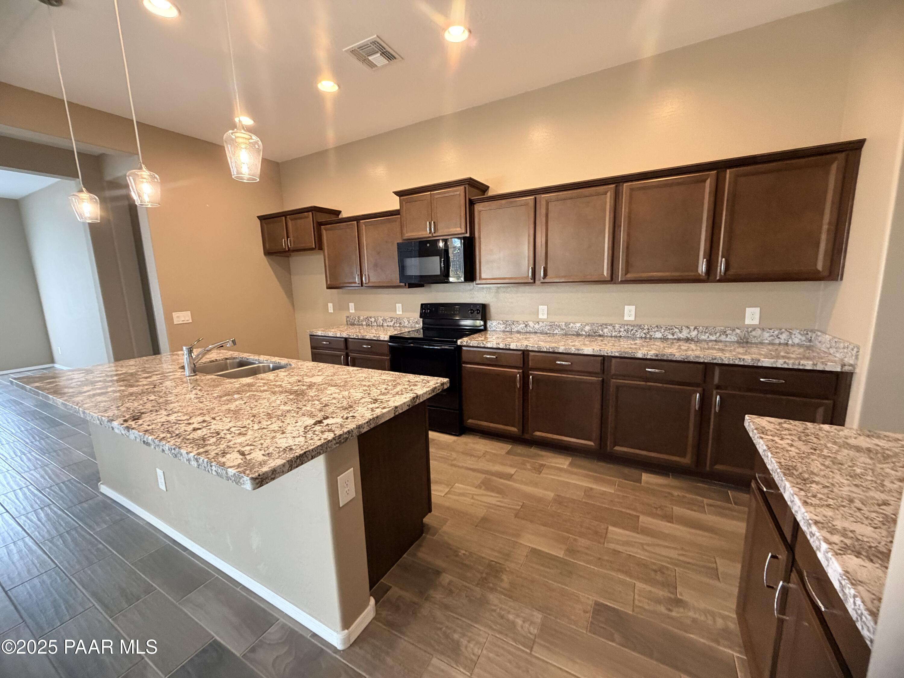 12937 East Sandoval Street Dewey, AZ 86327 - Photo 18 of 27 a kitchen with a sink and cabinets