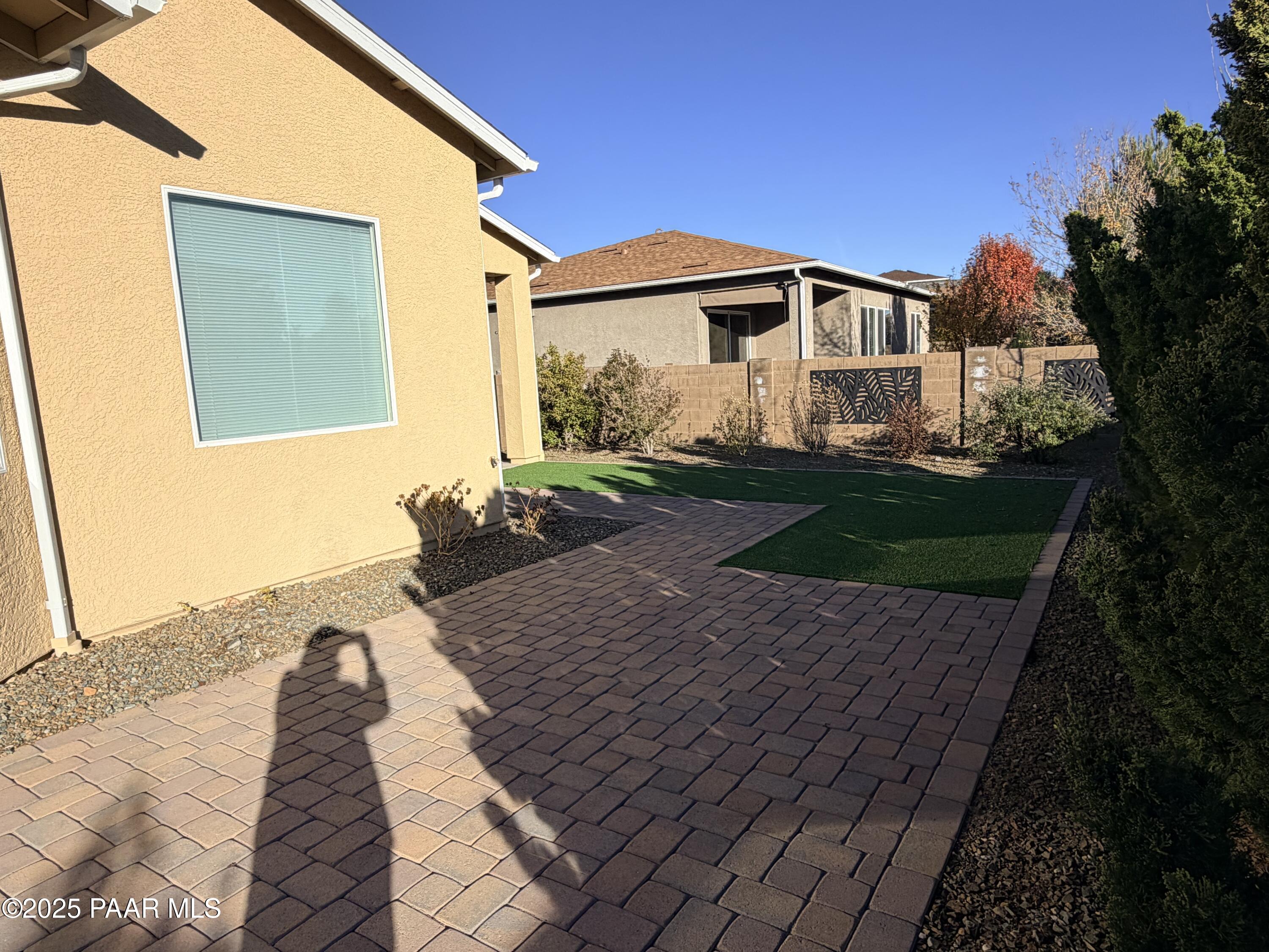 12937 East Sandoval Street Dewey, AZ 86327 - Photo 22 of 27 a front view of a house with garden