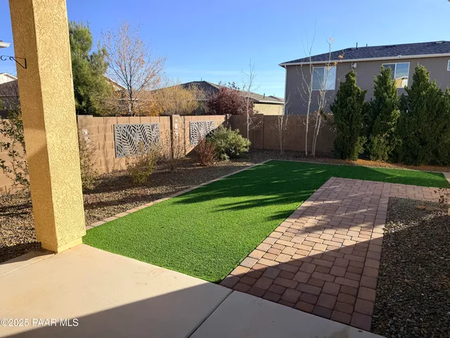 a view of a back yard of the house