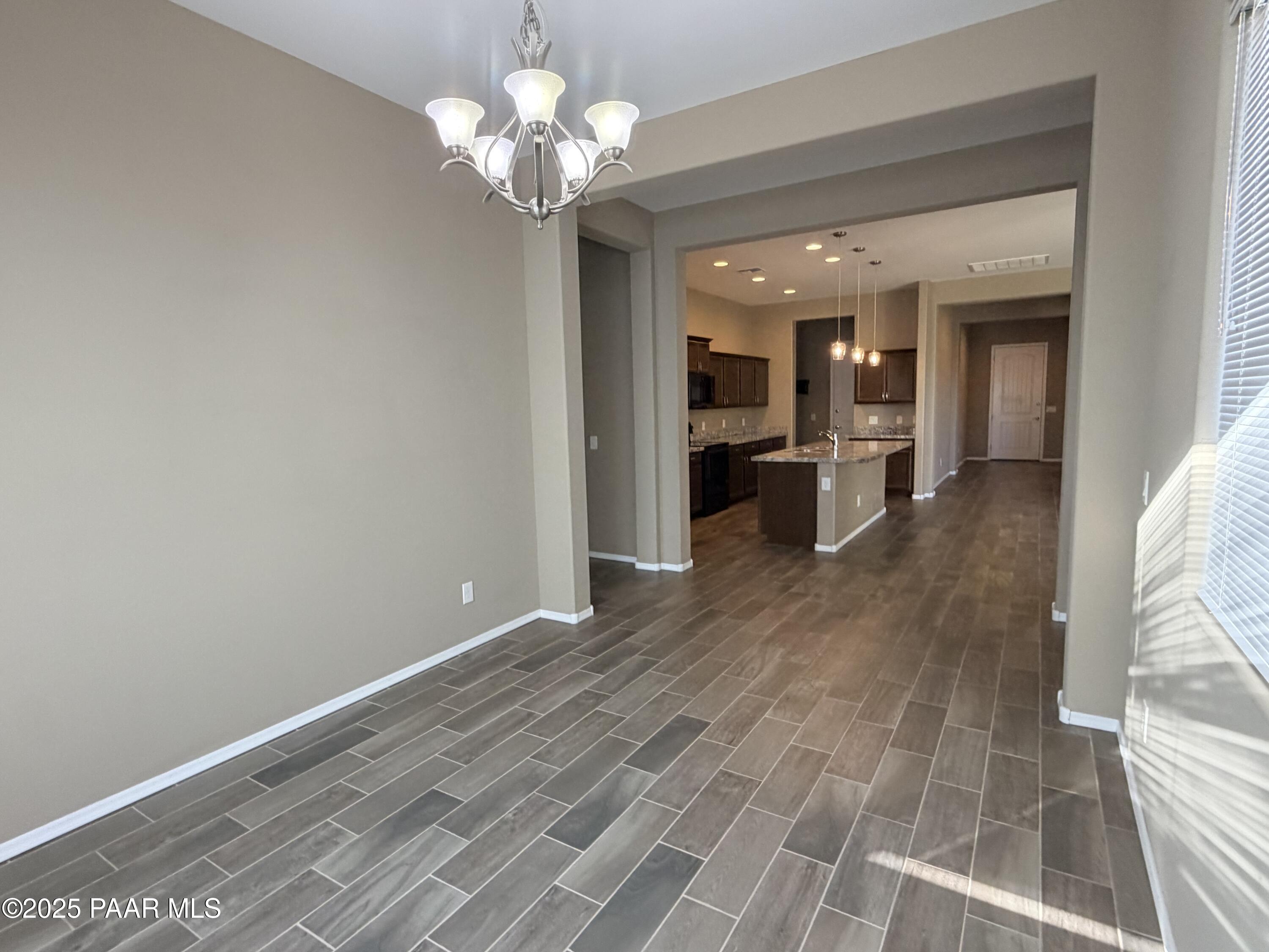 12937 East Sandoval Street Dewey, AZ 86327 - Photo 8 of 27 wooden floor in an empty room with a window
