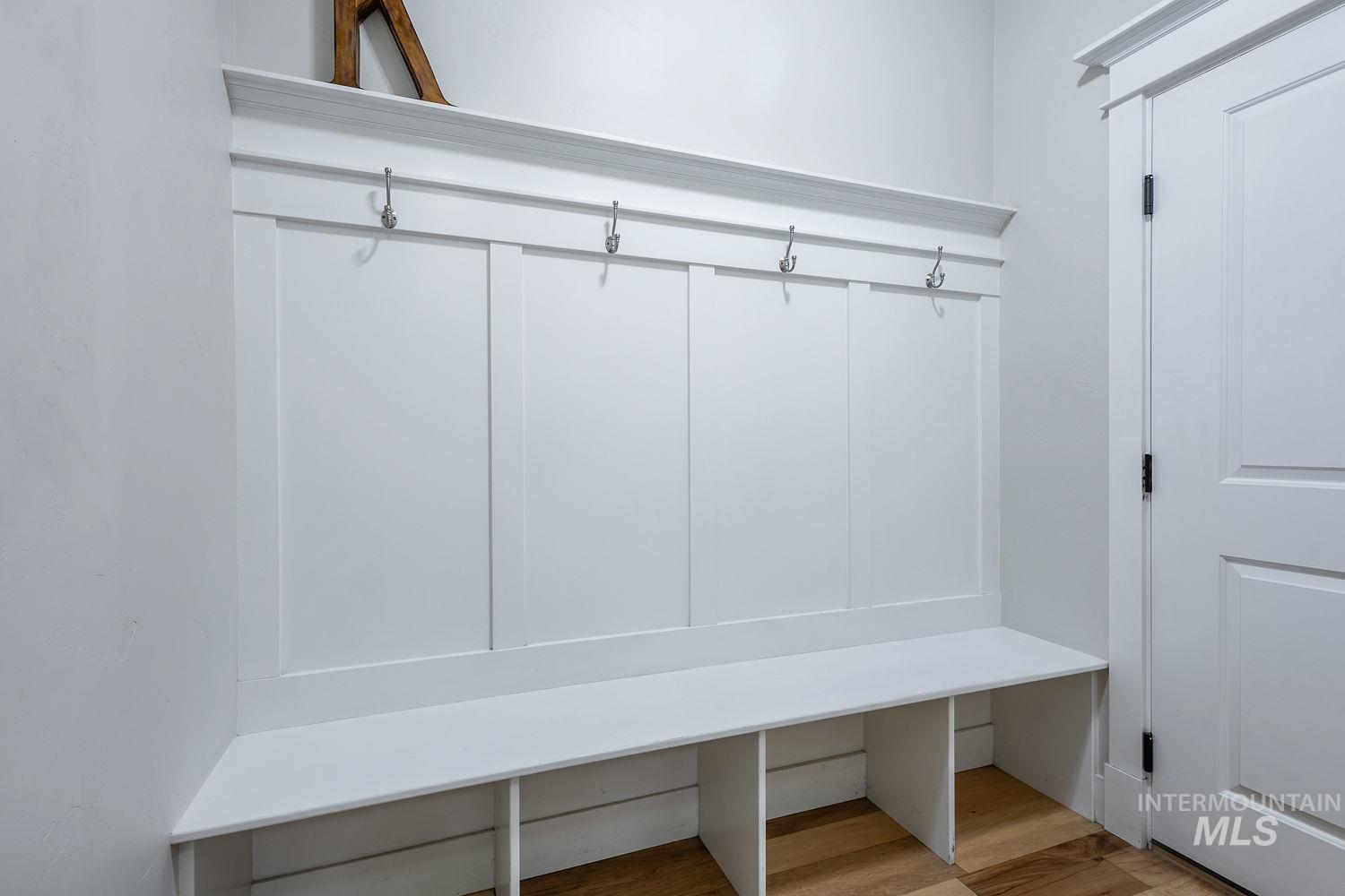 8077 Star Pass Ridge Road Nampa, ID 83686 - Photo 21 of 37 Built-in mudroom bench featuring integrated storage cubbies and four coat hooks