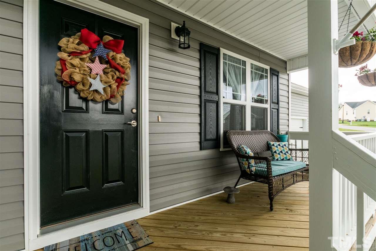 44 Henry Rifle Lane Angier, NC 27501 - Photo 2 of 22 a view of a house with a porch