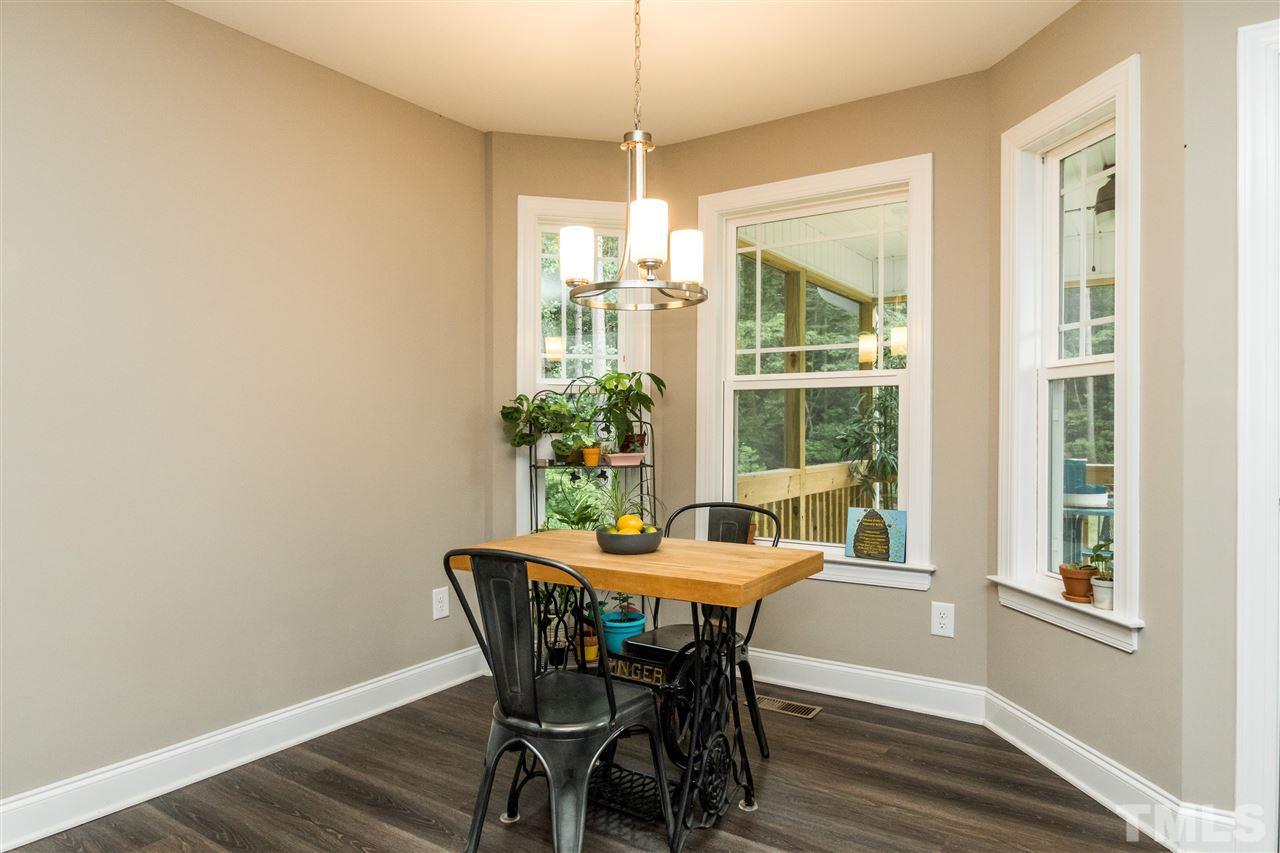 44 Henry Rifle Lane Angier, NC 27501 - Photo 11 of 22 a dining room with furniture window and wooden floor