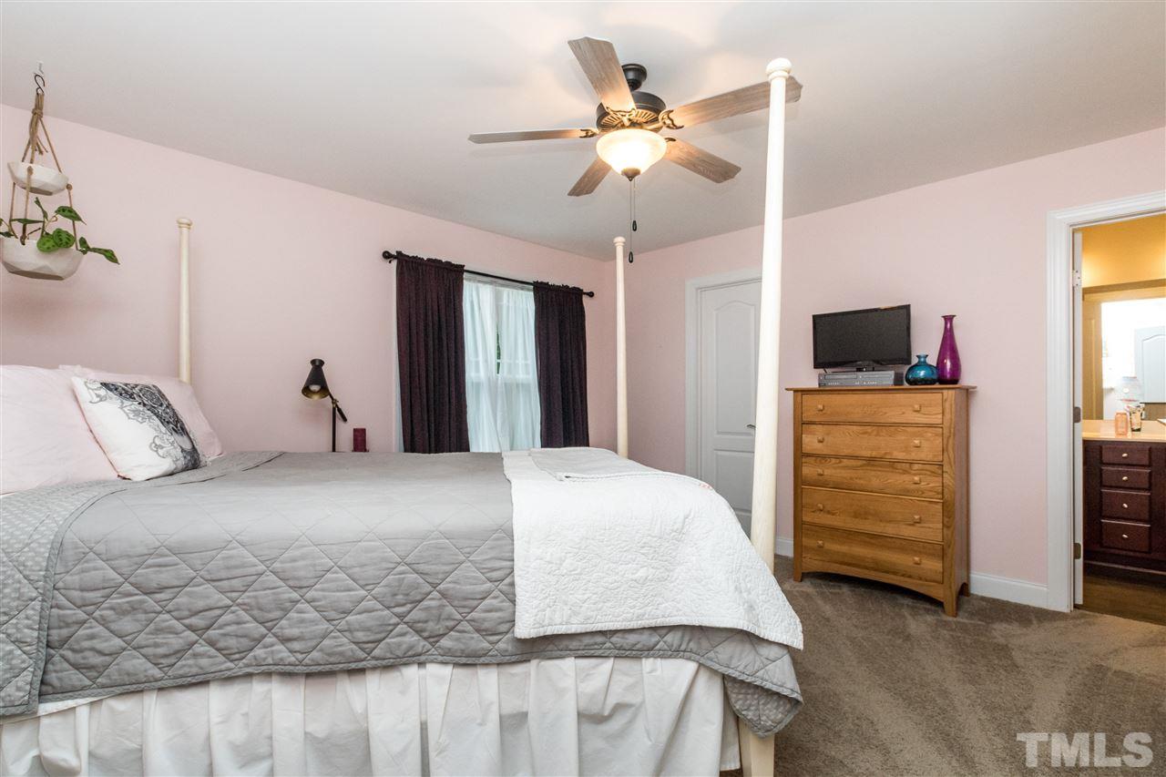 44 Henry Rifle Lane Angier, NC 27501 - Photo 12 of 22 a bedroom with a bed and a television