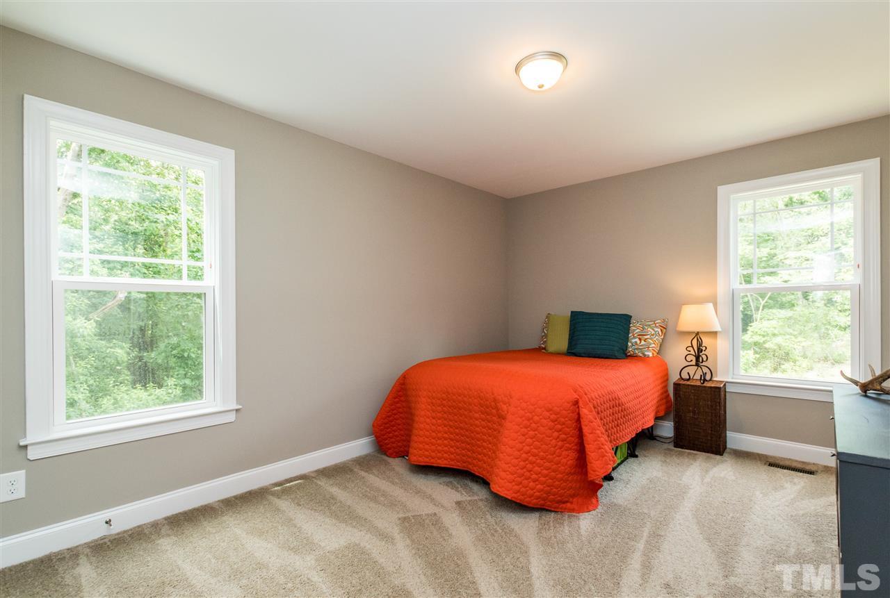 44 Henry Rifle Lane Angier, NC 27501 - Photo 16 of 22 a bedroom with a bed and window