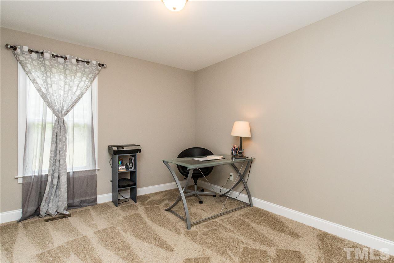 44 Henry Rifle Lane Angier, NC 27501 - Photo 18 of 22 a room with furniture and a window