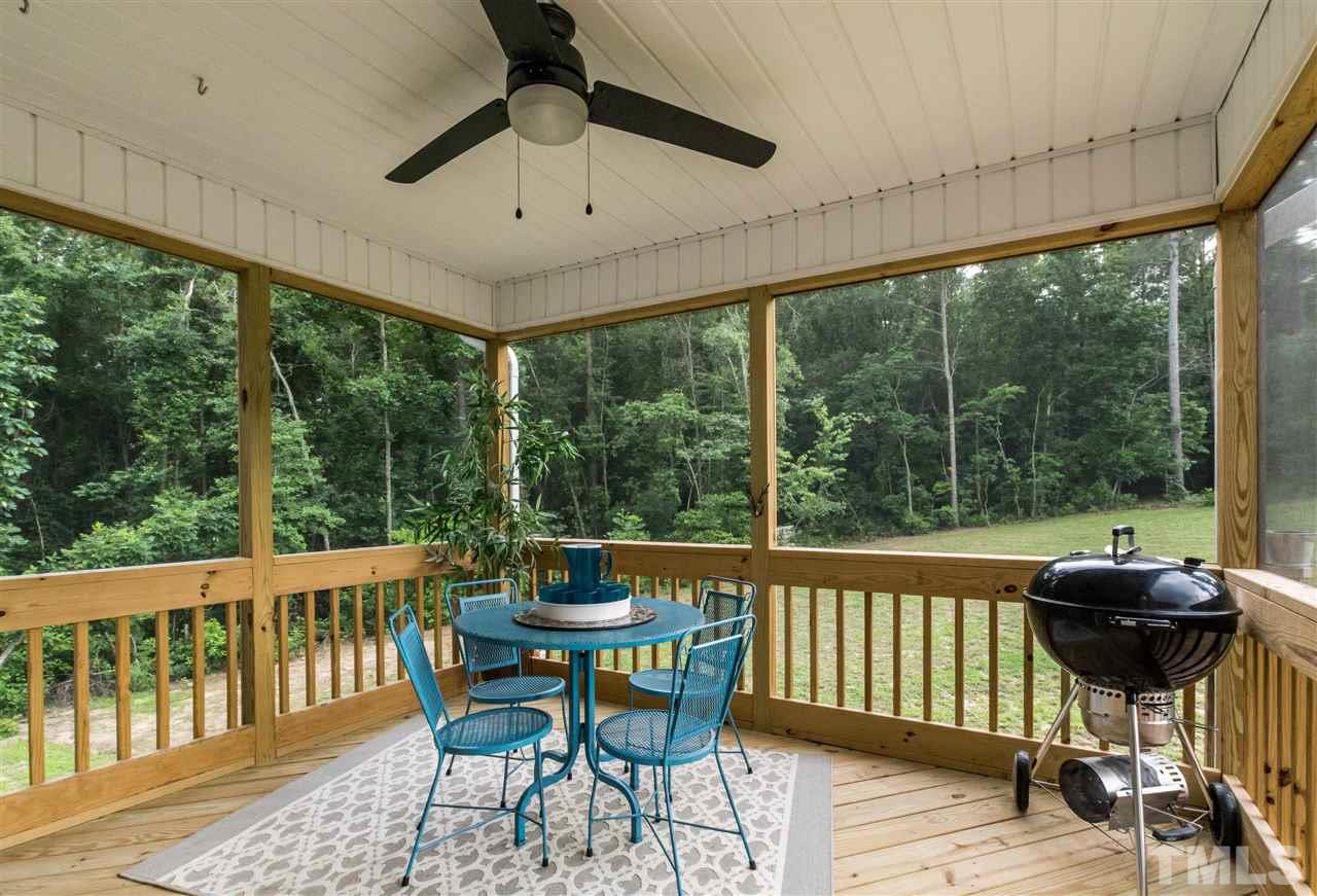 44 Henry Rifle Lane Angier, NC 27501 - Photo 19 of 22 a view of a chairs and table in patio