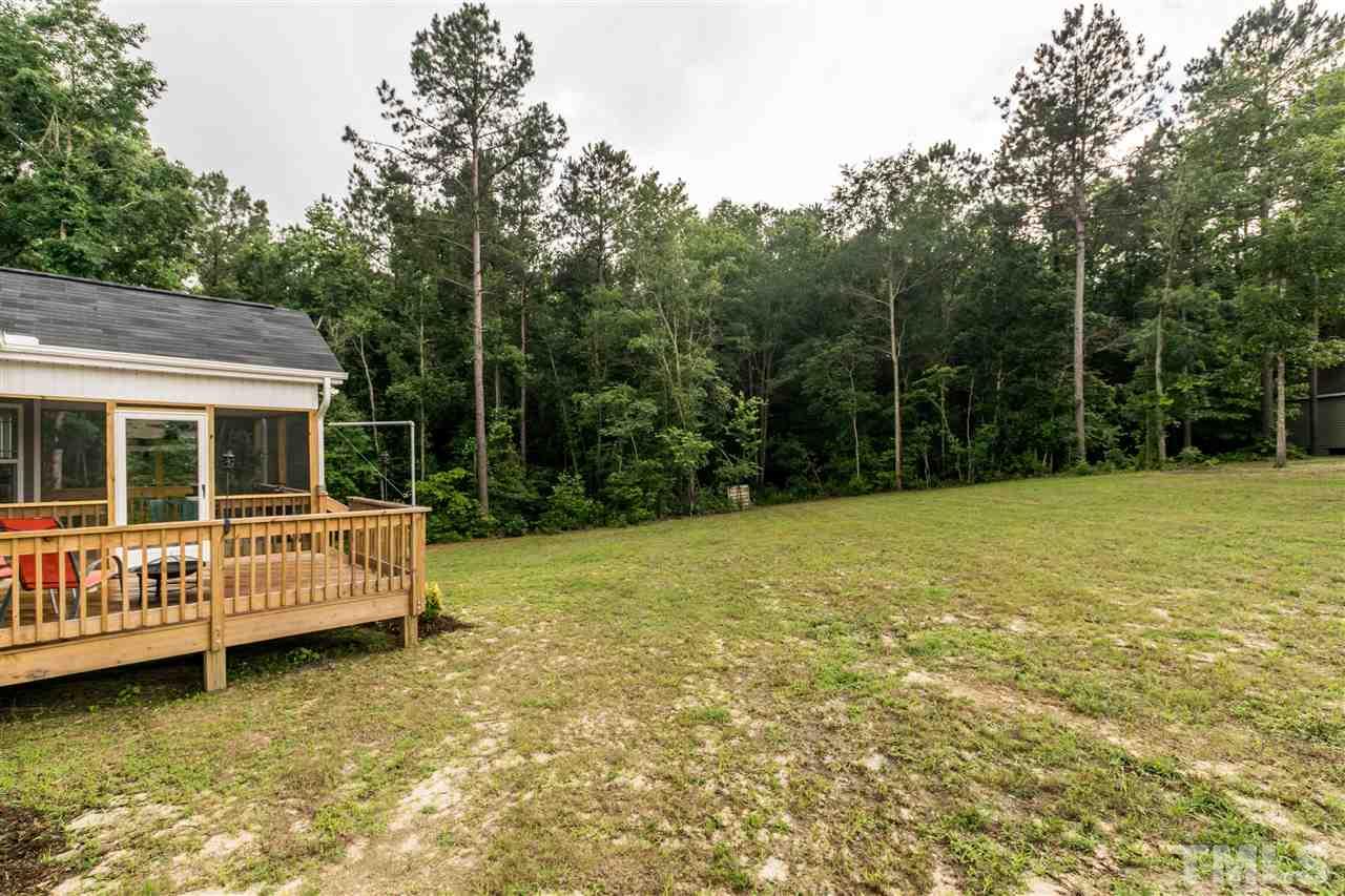 44 Henry Rifle Lane Angier, NC 27501 - Photo 20 of 22 a view of a house with backyard and sitting area