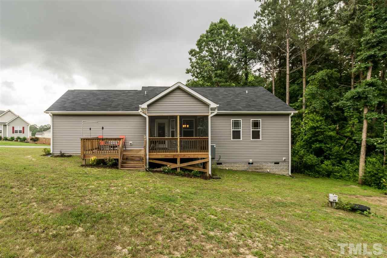 44 Henry Rifle Lane Angier, NC 27501 - Photo 21 of 22 a view of a house with a yard and sitting area
