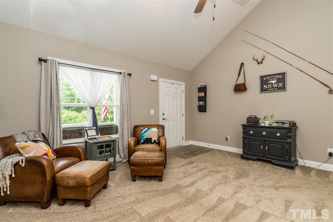 44 Henry Rifle Lane Angier, NC 27501 - Photo 5 of 22 a living room with furniture and a large window