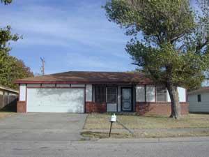 4407 South Austin Street Amarillo, TX 79110 - Photo 1 of 1 a front view of a house with a garden and yard