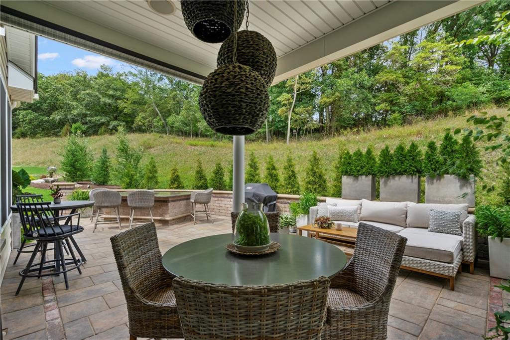 107 Resolution Drive Mars, PA 16046 - Photo 15 of 44 a view of a patio with couches chairs and a potted plant