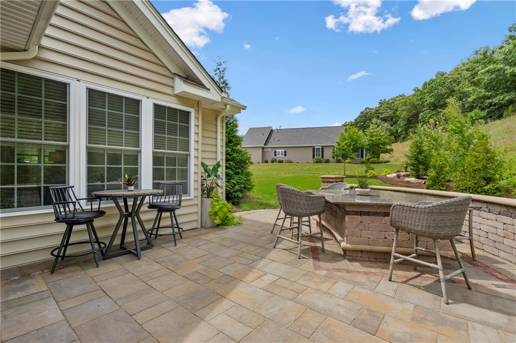 107 Resolution Drive Mars, PA 16046 - Photo 17 of 44 a view of a house with backyard sitting area and garden