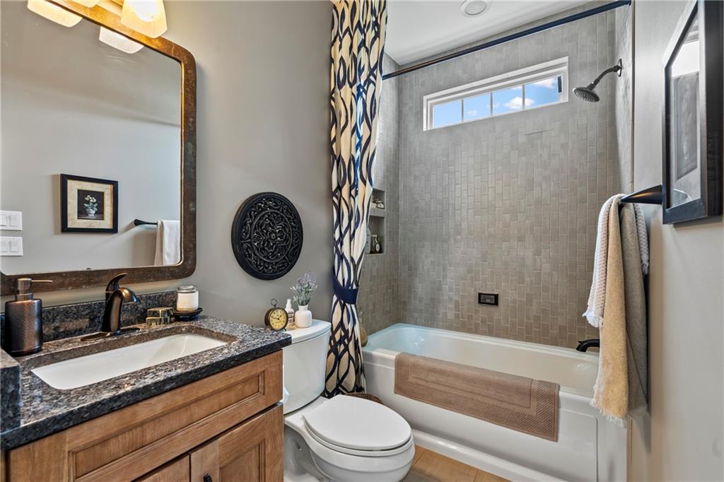 107 Resolution Drive Mars, PA 16046 - Photo 23 of 44 a bathroom with a granite countertop bathtub sink vanity mirror and toilet
