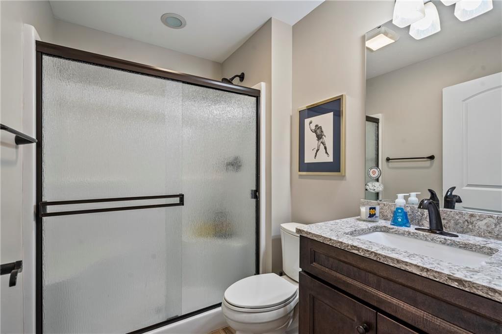 107 Resolution Drive Mars, PA 16046 - Photo 29 of 44 a bathroom with a granite countertop shower sink vanity and toilet