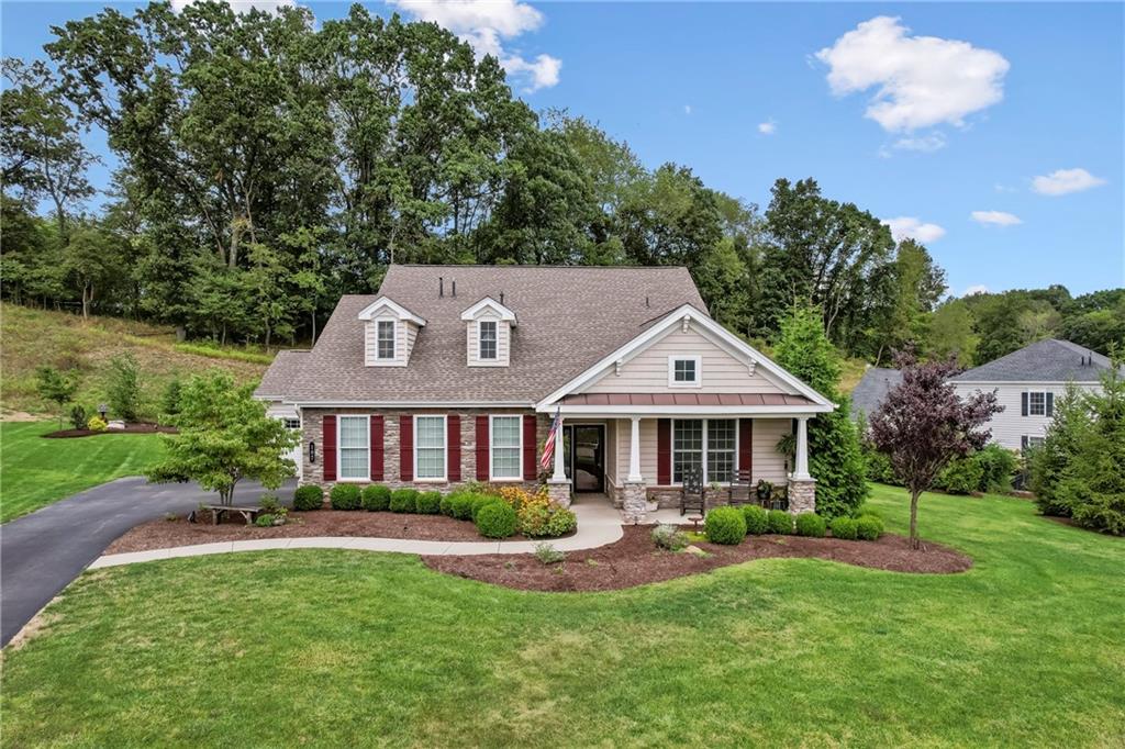 107 Resolution Drive Mars, PA 16046 - Photo 33 of 44 a front view of a house with a yard table and chairs
