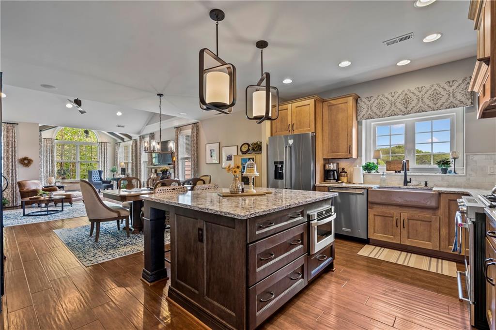 107 Resolution Drive Mars, PA 16046 - Photo 5 of 44 a kitchen with stainless steel appliances granite countertop a stove and a wooden floors