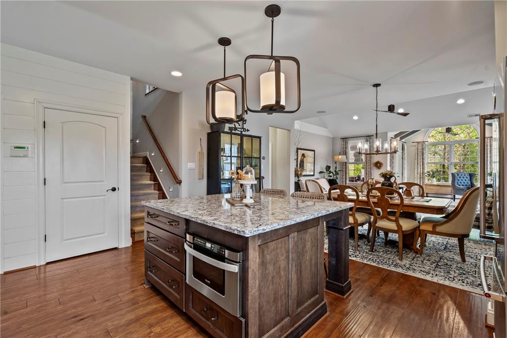 107 Resolution Drive Mars, PA 16046 - Photo 7 of 44 a view of a dining room and livingroom with furniture wooden floor a chandelier