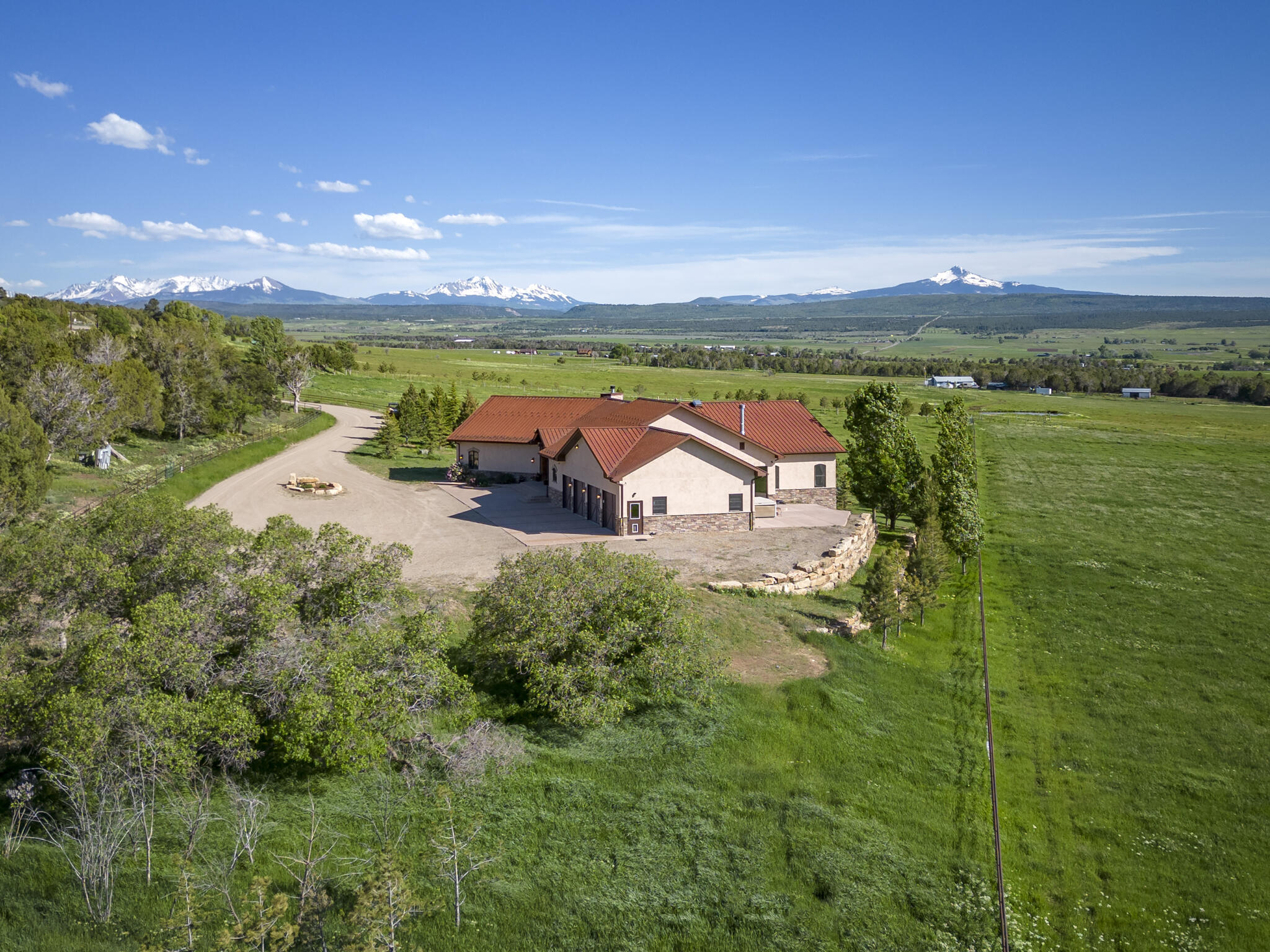 an aerial view of a houses with outdoor space