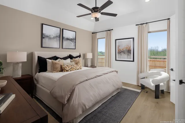 a bedroom with a bed and a painting on the wall