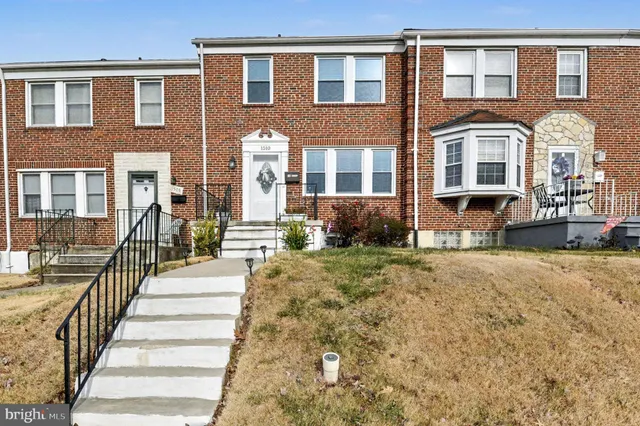 a view of a brick building with many windows