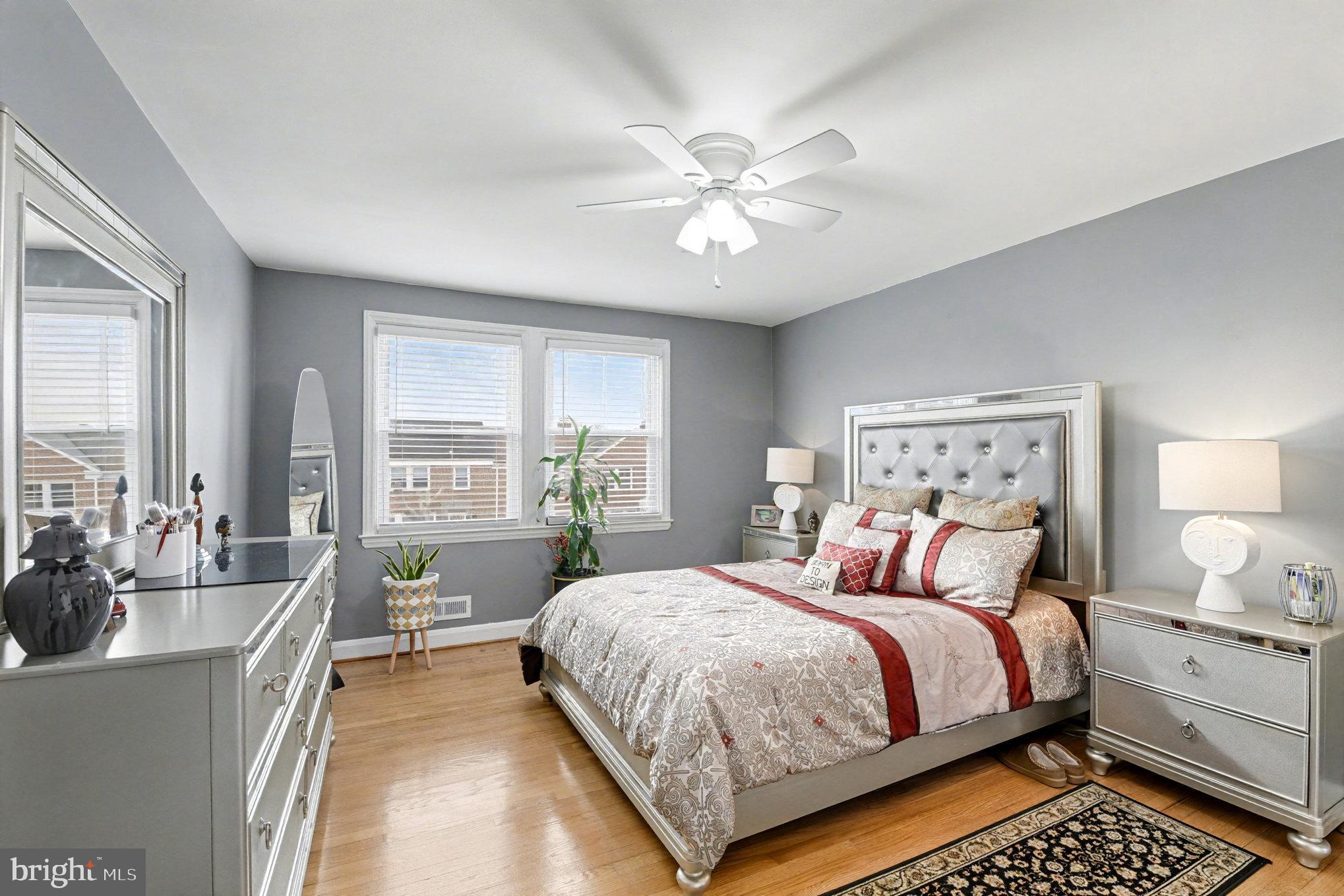 1510 Medford Road Baltimore, MD 21218 - Photo 13 of 30 a bedroom with a large bed and a chandelier